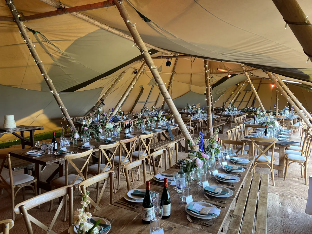 Inside a tipi wedding reception in the Yorkshire countryside, catered by Trufflehunters